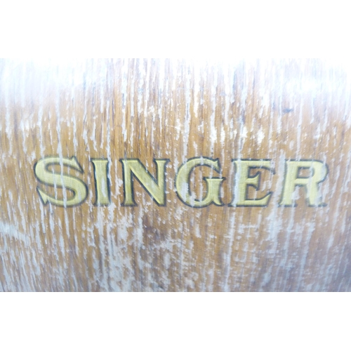 83 - Singer portable sewing machine in fitted case.