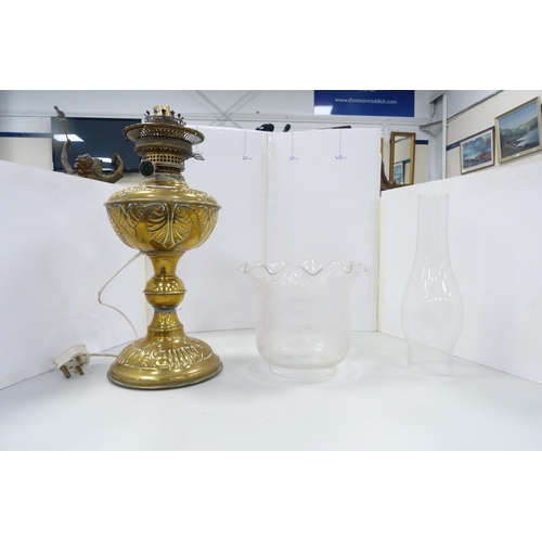 86 - Early 20th century brass oil lamp with later glass shade and funnel, converted to electricity.