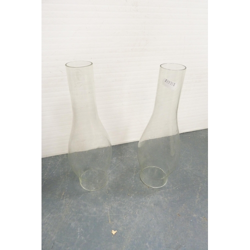 91 - Four oil lamp shades to include a tinted glass example, and two oil lamp funnels.  (6)