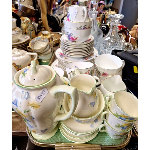 344 - Crescent ware floral decorated part tea set and a Royal Doulton part coffee set.