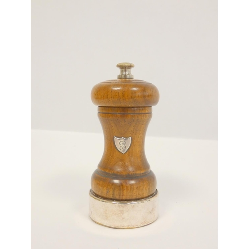 11 - Silver mounted wooden pepper mill and another.(2)