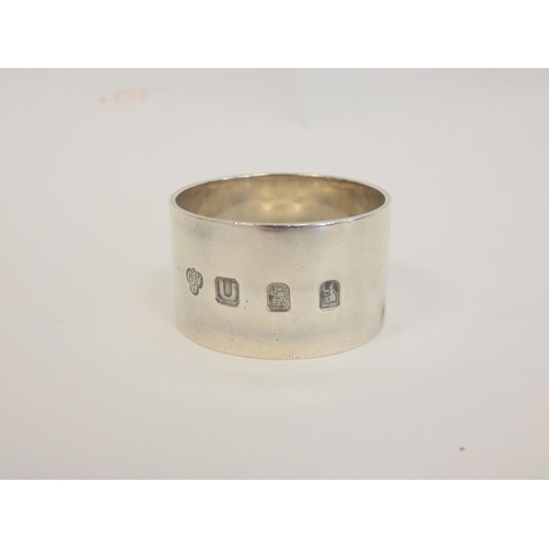 12 - Silver napkin ring Britannia standard 1955 and eight others, 268g. (9)