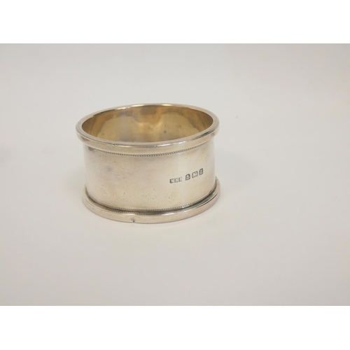 12 - Silver napkin ring Britannia standard 1955 and eight others, 268g. (9)