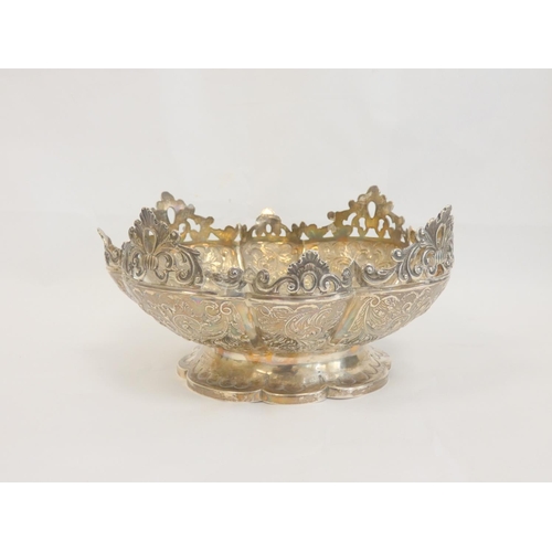 19 - Silver embossed circular bowl with pierced handles by Charles Edwards, 1892, 23cm. 562g. 