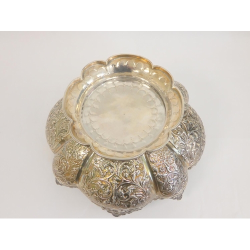 19 - Silver embossed circular bowl with pierced handles by Charles Edwards, 1892, 23cm. 562g. 