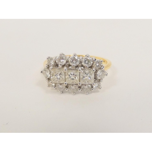 30 - 18ct diamond ring with three princess cut brilliants surrounded by twelve others. Size 'N½'.