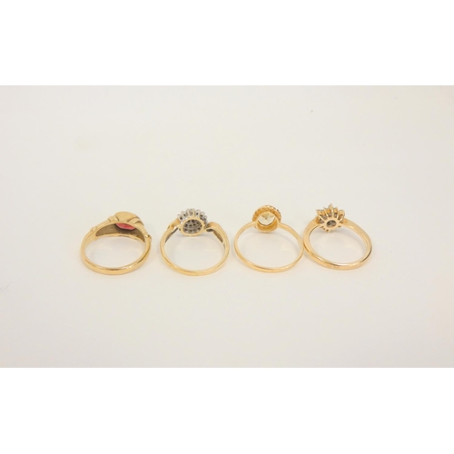 36 - Four gem rings in 9ct gold. 10g gross. 