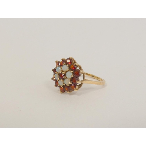 40 - Two garnet cluster rings and a cameo ring, all 9ct gold. 