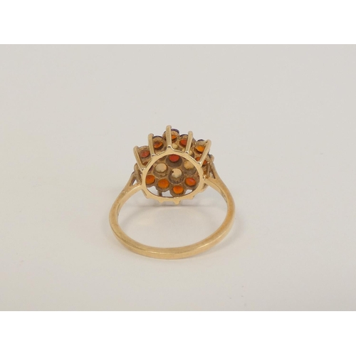 40 - Two garnet cluster rings and a cameo ring, all 9ct gold. 