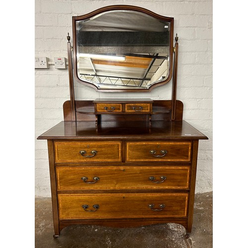 563 - Inlaid mahogany two over two dressing chest, raised on casters. H 170cm, W 106.5cm, D 51cm.