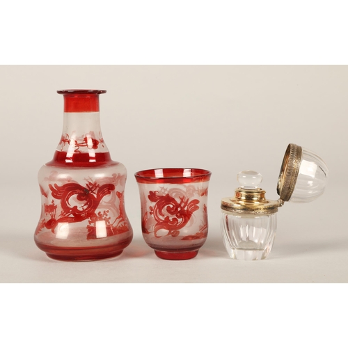 217 - Silver rimmed glass scent bottle illegibly marked continental, and a miniature decanter and glass wi... 