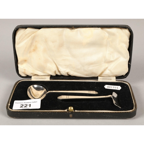 221 - Silver child's spoon and pusher set in fitted case 'Presented by the Proprietors of Sister Laura's F... 