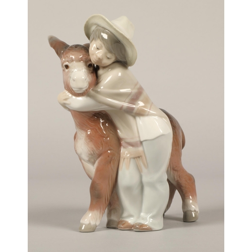 24 - Lladro Porcelain Figure 'Platero and Marcelino' Boy Hugging Donkey 20cm high.