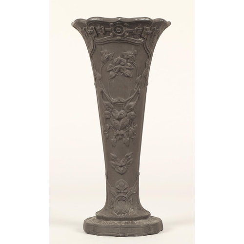 35 - Wedgewood black basalt vase decorated in relief with floral and leaf tendrils. 24cm