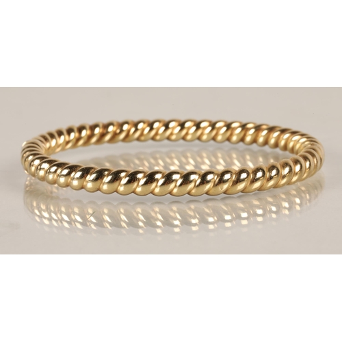 62 - 9ct gold twist bangle, 14.3g