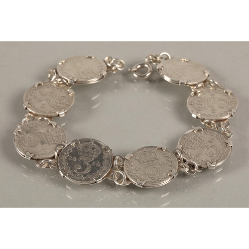 77 - George V threepenny coins mounted in white metal bracelet, gross weight 17.8g