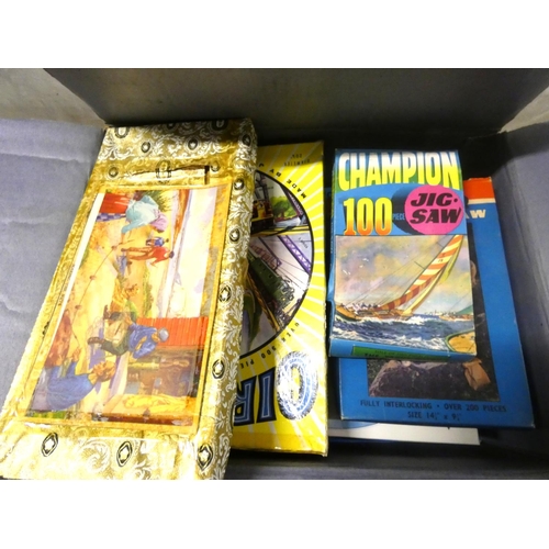 244 - Large box of vintage jigsaw puzzles.