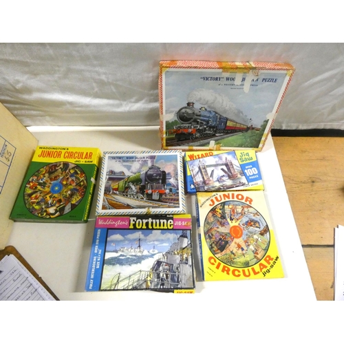 244 - Large box of vintage jigsaw puzzles.