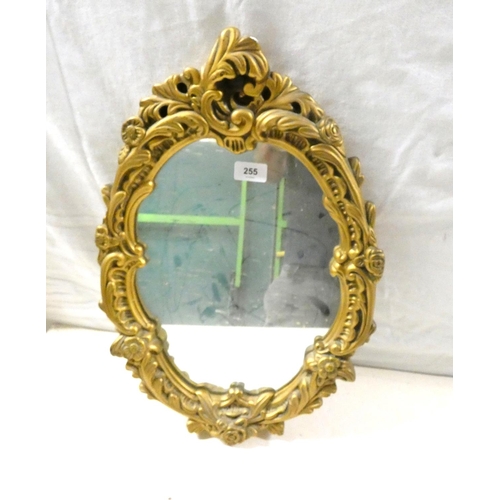 255 - Oval, gilt frame mirror.