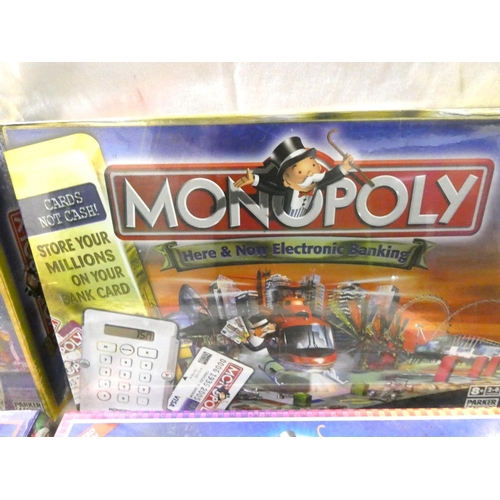 274 - Four boxes of new Monopoly to include Carlisle edition.