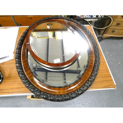 309 - Two antique mahogany wall mirrors.