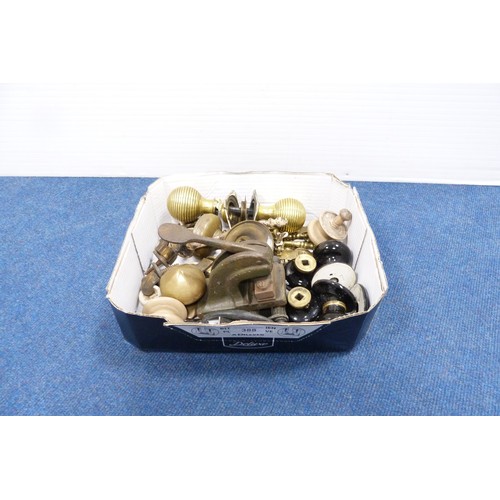 388 - Quantity of brass and other door handles, castors, name punch etc.