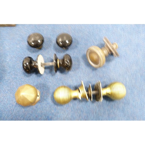 388 - Quantity of brass and other door handles, castors, name punch etc.