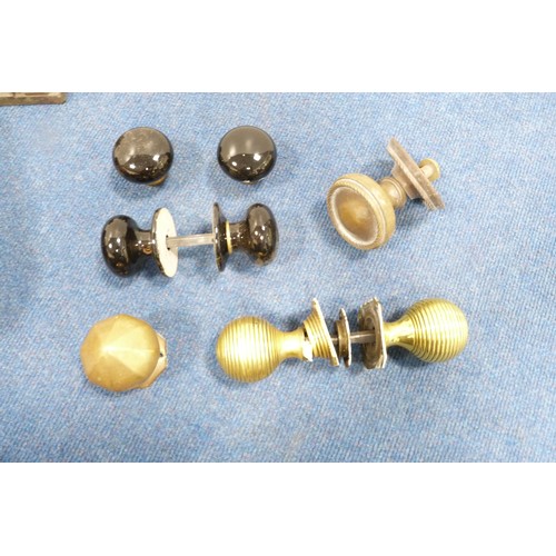 388 - Quantity of brass and other door handles, castors, name punch etc.