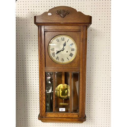 427 - Oak wall clock, approx. 80cm high