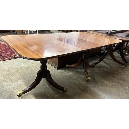 580 - Mahogany extending dining table, raised on tripod legs & castors. Dimensions (unextended, excl. ... 