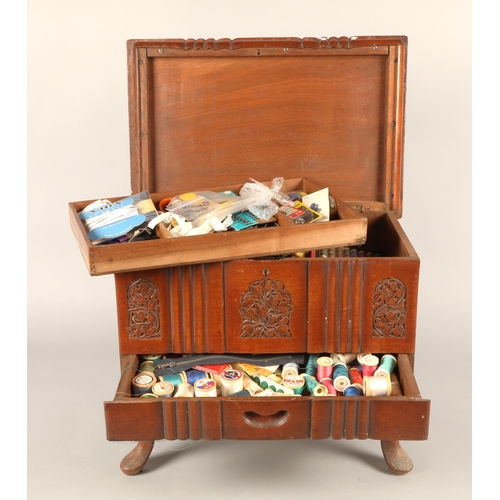 547 - Carved mahogany sewing box with assorted accessories incl. thread, pins, fasteners, etc 