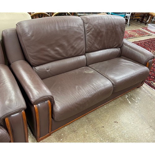 604 - Three piece leather suite comprising of three seater settee and two easy chairs