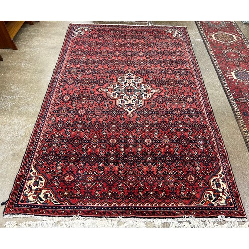 605 - Large Persian-style rug, 275cm x 174cm