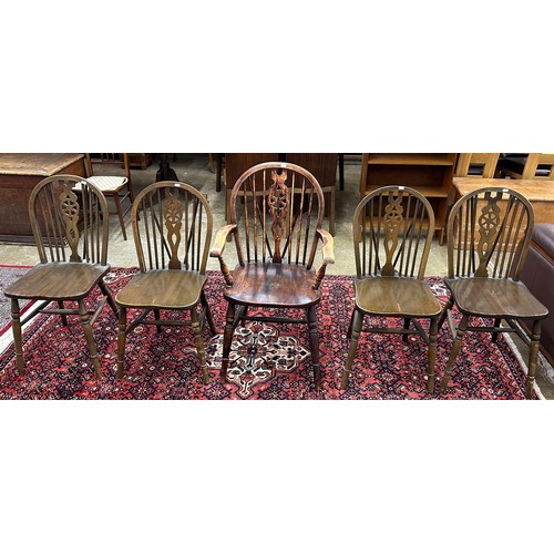 610 - Five wheel back kitchen chairs including carver chair