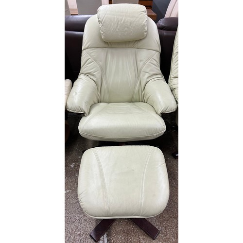 612 - Cream leather swivel chair with footstool