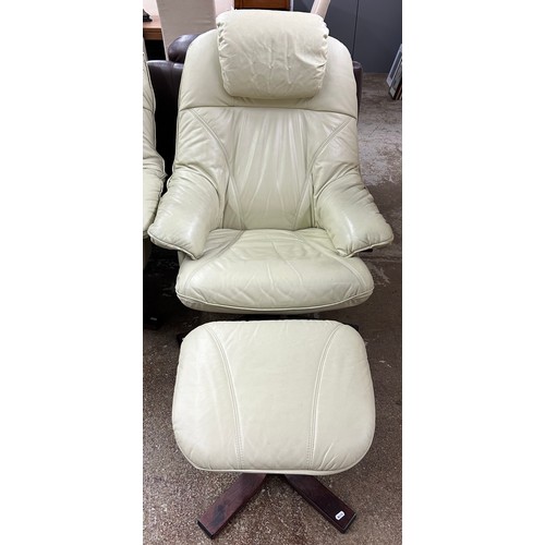 613 - Cream leather armchair with footstool