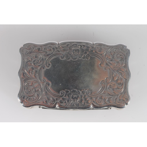 48 - Antique Victorian silver snuff box of rectangular shape with serpentine edge, the body incised with ... 