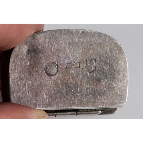 56 - French import silver snuff or pill box of pouch shape, the hinged lid decorated in high relief with ... 