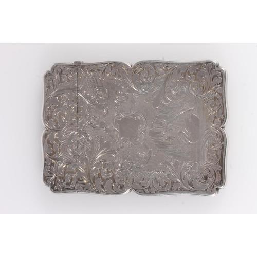 62 - Antique Victorian silver card case of rectangular form having serpentine edge, the body with engine ... 