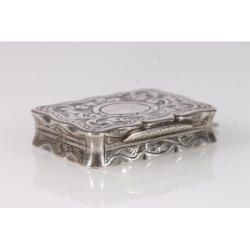 93 - Antique Victorian silver vinaigrette of rectangular shape with serpentine edge, the body decorated a... 