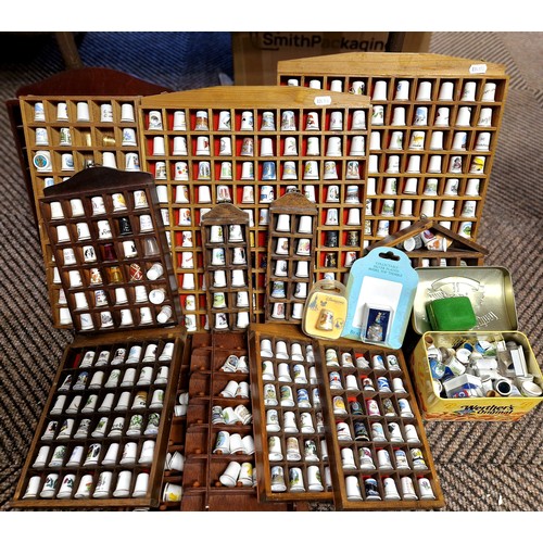 373 - Large collection of thimbles and display shelves.