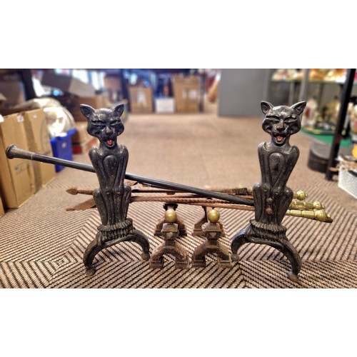 374 - Pair of cat andirons also three piece brass fireside tools, other andirons and companion tools, and ... 