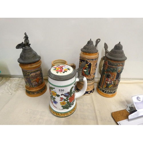 330 - Five vintage German beer steins.