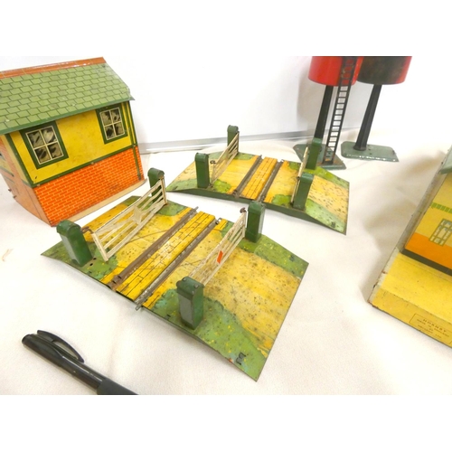 373 - Large box of tinplate 0-gauge buildings to include stations No2, No3, goods shed etc.