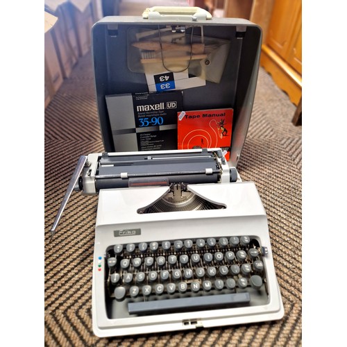 387 - Vintage Erika typewriter, reel, and booklet