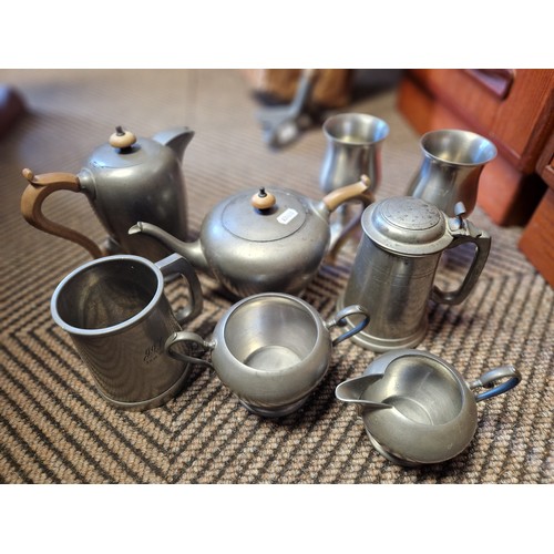 395 - Collection of pewter to include four piece tea set, tankards, goblets etc.