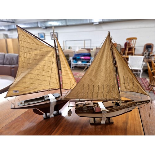 198 - Two wooden model sailing ships