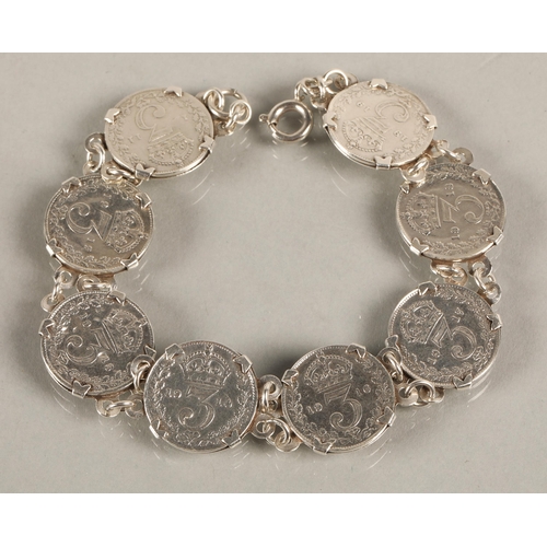 77 - George V threepenny coins mounted in white metal bracelet, gross weight 17.8g