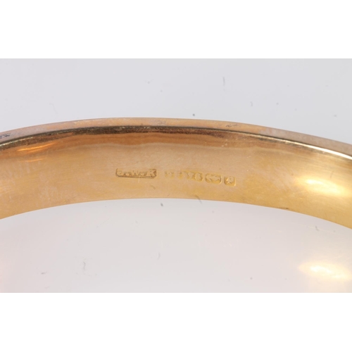 143 - 9ct hollow gold bangle, maker JWK Birmingham hallmarks, 12g.