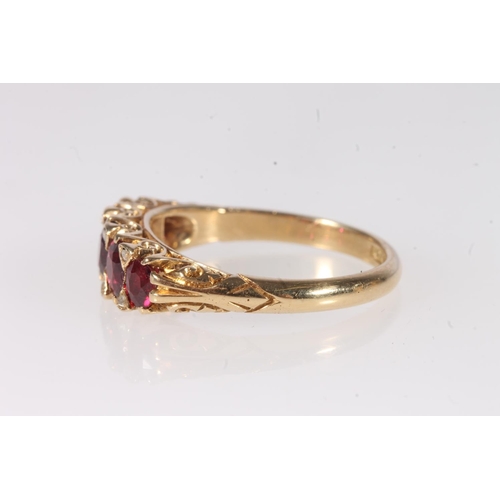 146 - 18ct gold ruby and diamond thirteen stone ring, makers mark 'AH&S' and stamped '18ct', ring size... 